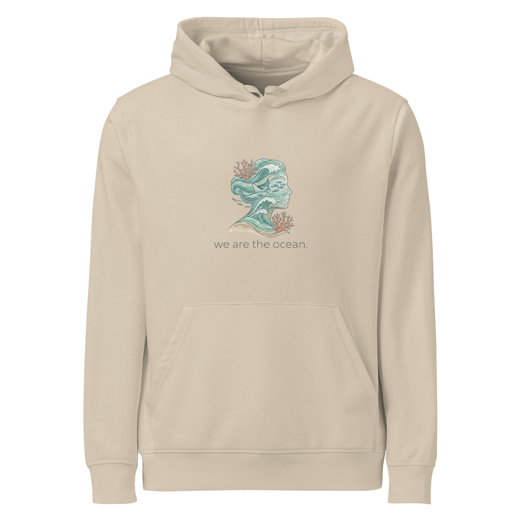 A front-facing flat lay of the beige organic mid-weight hoodie. The centerpiece is a detailed illustration of a face profile formed by sea waves and marine life in muted teal and coral tones, accompanied by the text "we are the ocean." It features a kangaroo pocket and matching white drawstrings.