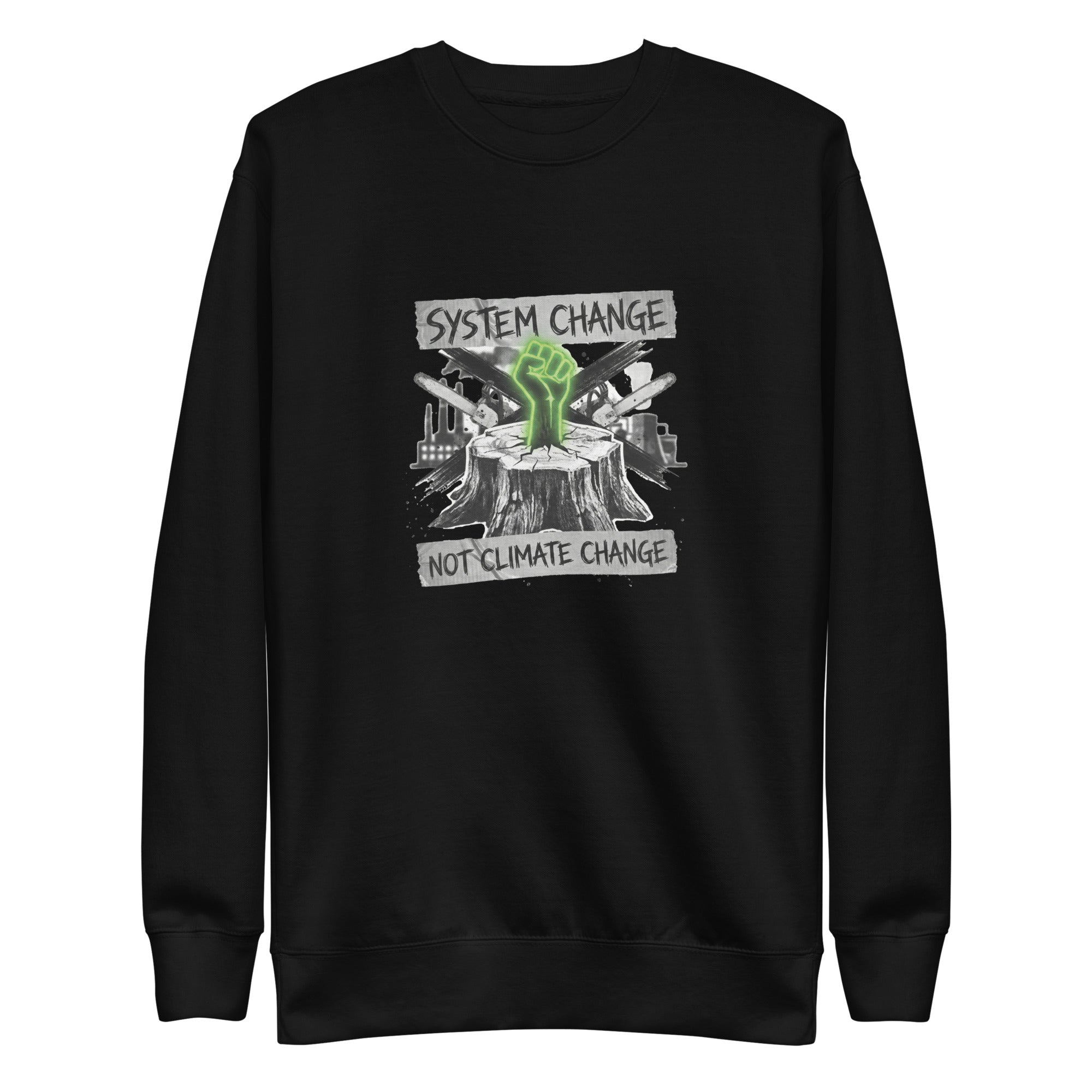 A high-resolution front view of a black organic sweatshirt. The central graphic features a neon green glowing fist rising from a tree stump, set against a backdrop of crossed chainsaws and an industrial factory skyline. Banners above and below the graphic read "SYSTEM CHANGE" and "NOT CLIMATE CHANGE" in a distressed font.
