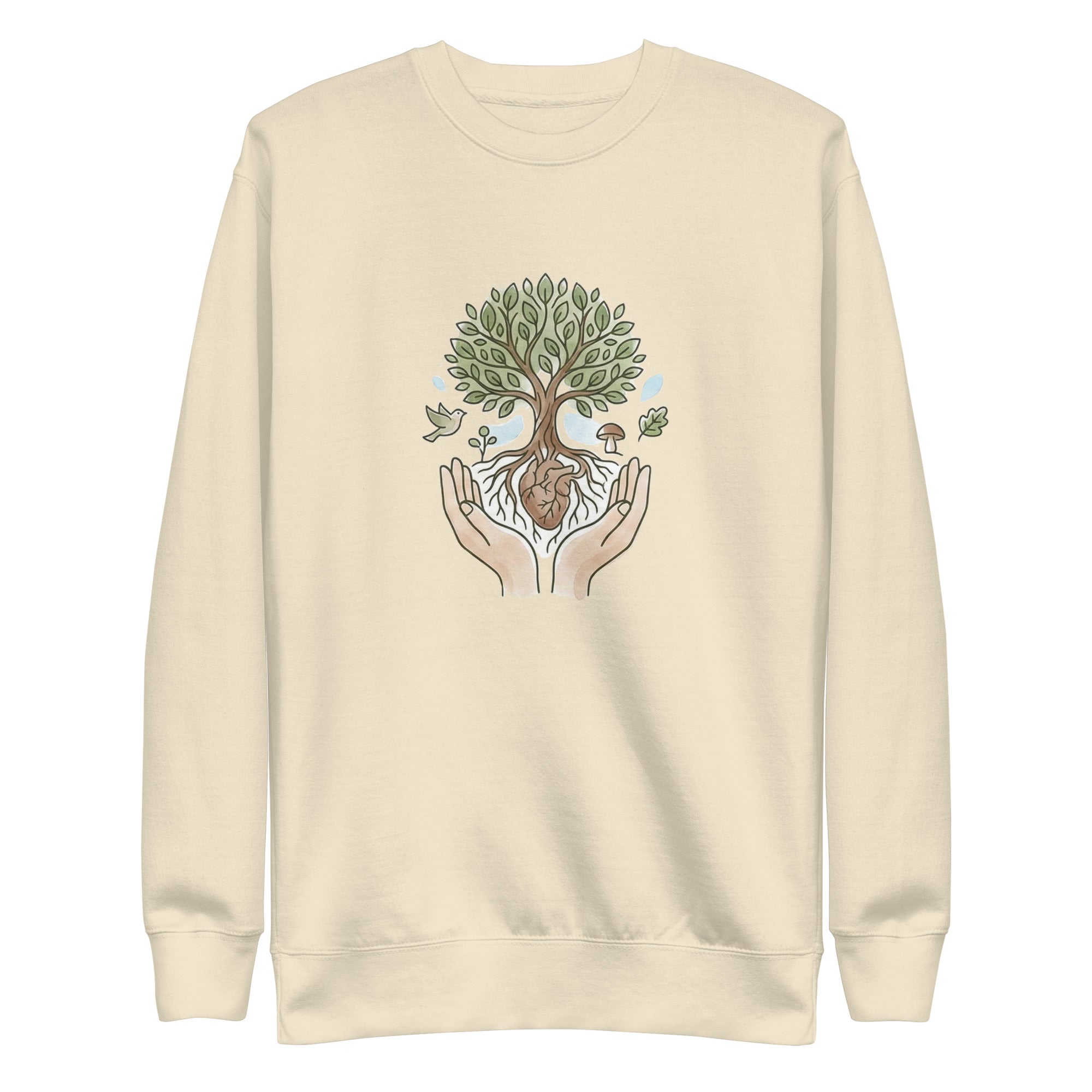 A front-facing flat lay of the bone beige sweatshirt. It features a central graphic of two hands cradling a tree with a heart at its roots, surrounded by a bird, a mushroom, and falling leaves in soft earth tones.