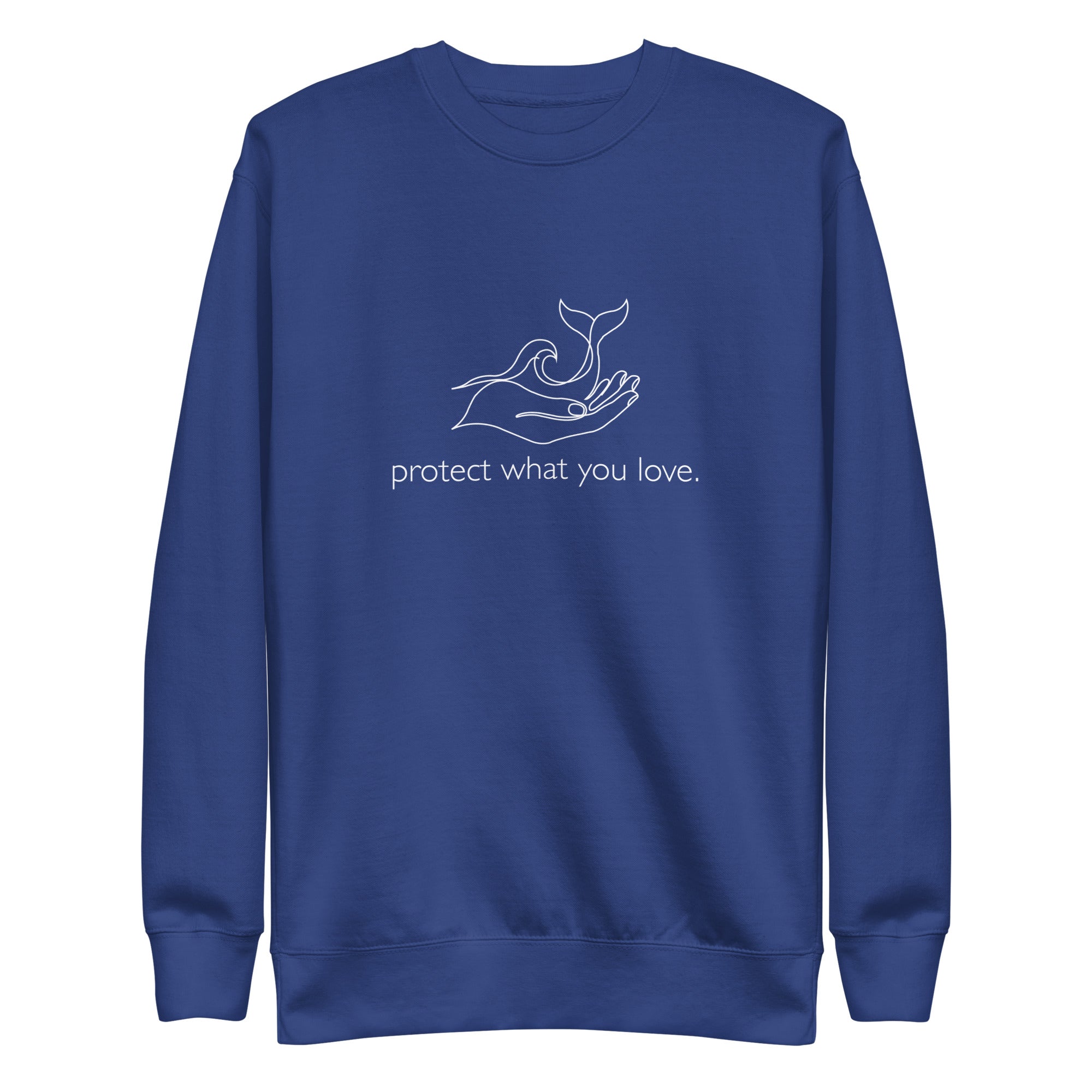A high-resolution front view of a blue organic crewneck sweatshirt. Centered on the chest is a minimalist white line art graphic of a hand cradling a whale's tail and an ocean wave, with the lowercase phrase "protect what you love." printed beneath it.