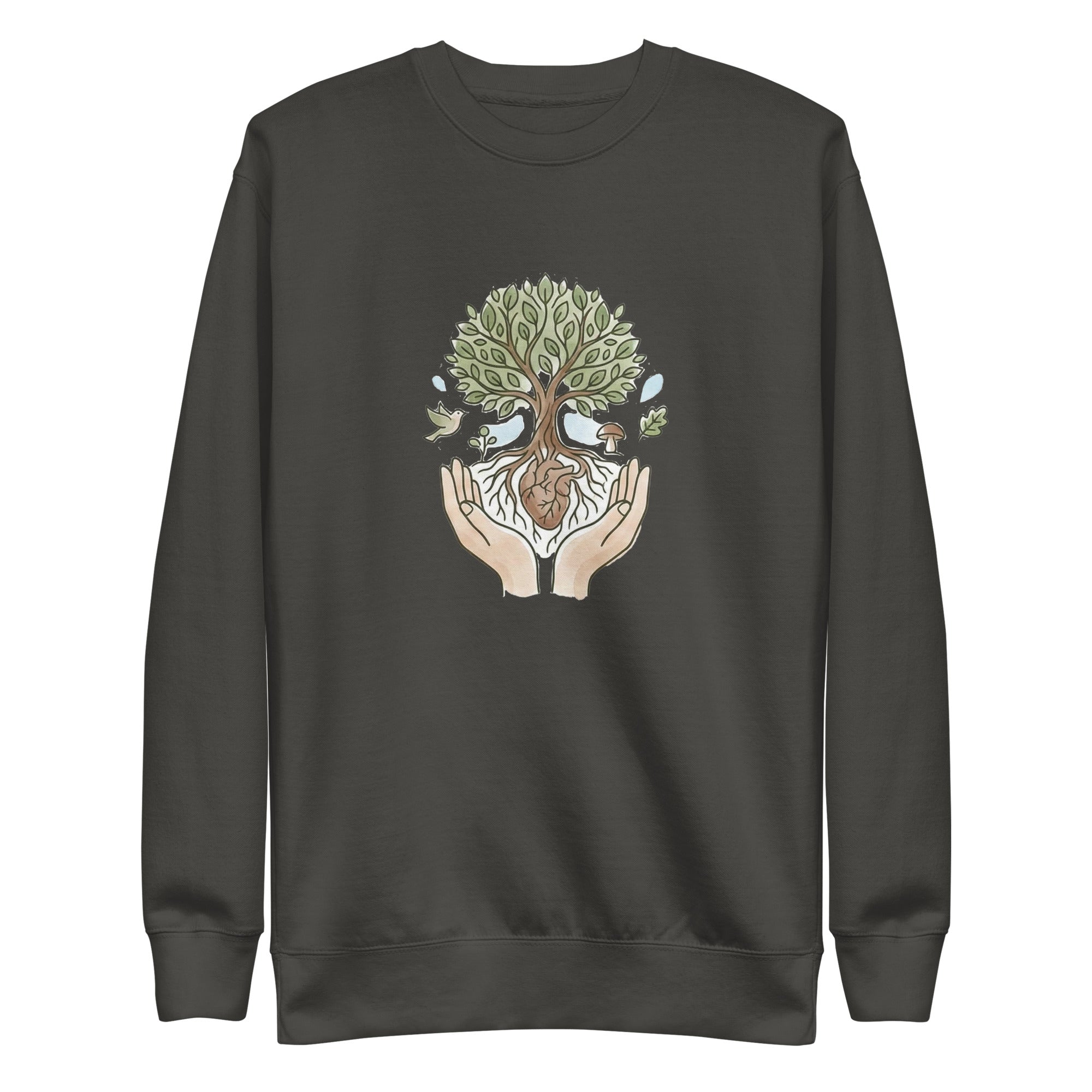 A front-facing flat lay of the vintage black sweatshirt. It features a central graphic of two hands cradling a tree with a heart at its roots, surrounded by a bird, a mushroom, and falling leaves in soft earth tones.
