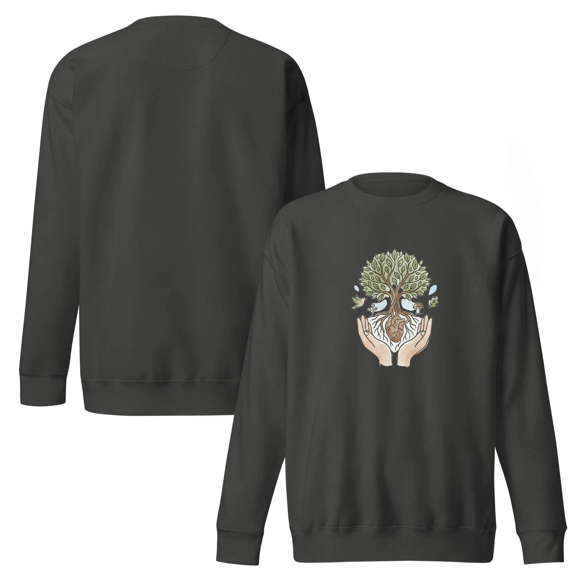A front-facing flat lay of the vintage black sweatshirts. It features a central graphic of two hands cradling a tree with a heart at its roots, surrounded by a bird, a mushroom, and falling leaves in soft earth tones.